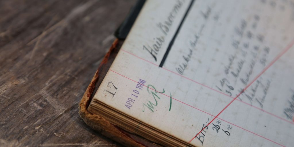 Old accounting ledger on a wooden desk