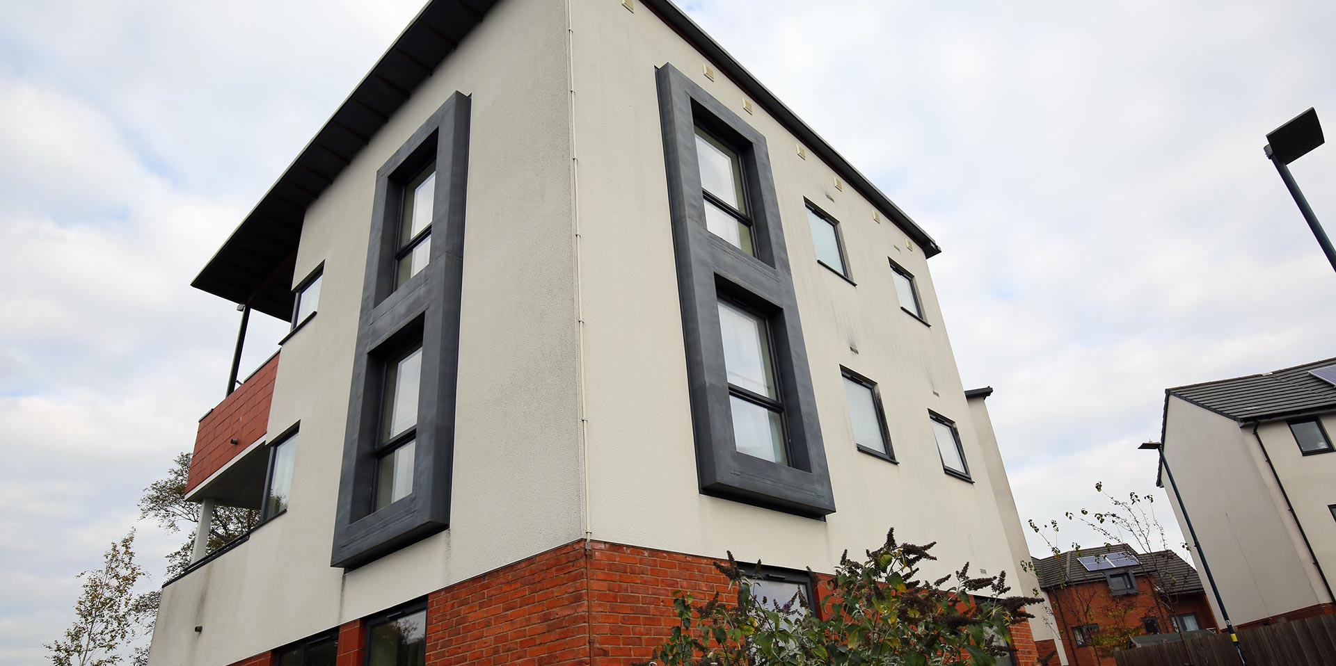 New build property with casement windows in grey PVCu