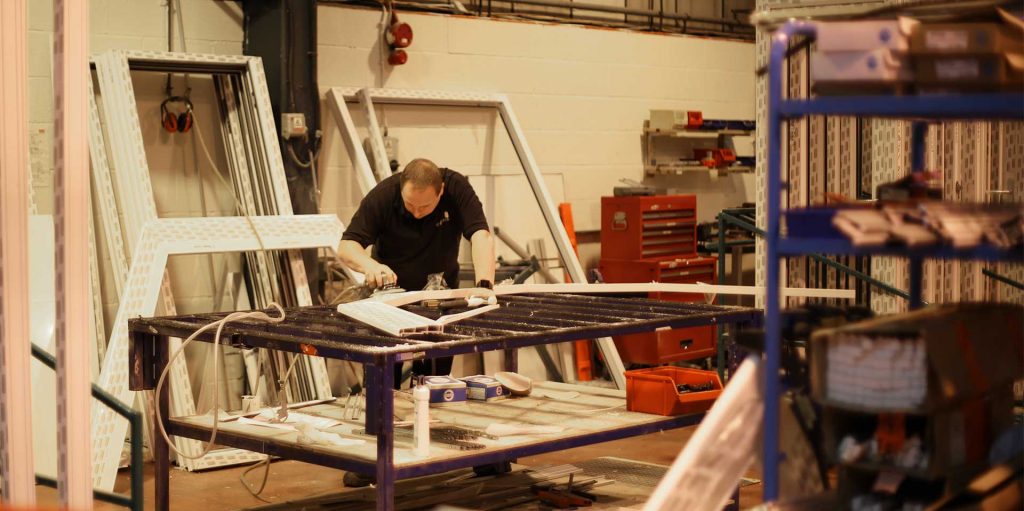 One of our long serving employees working on a PVCu frame