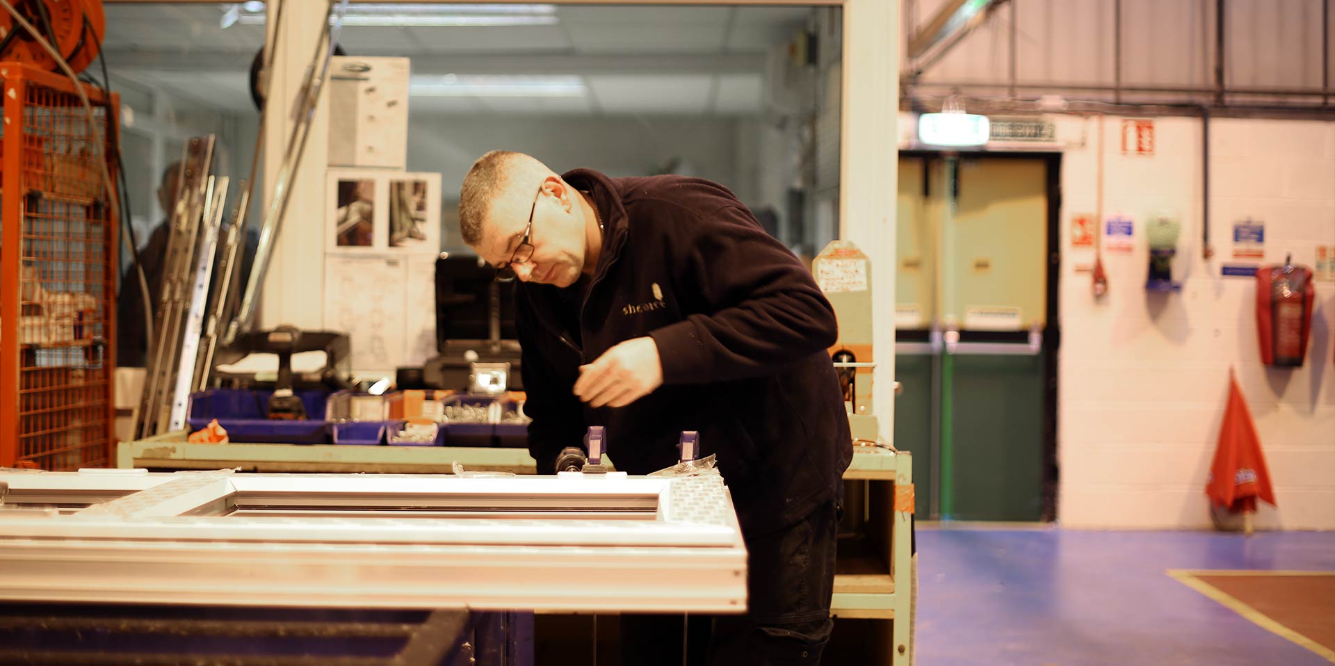 One of the Shelforce team working on a window frame