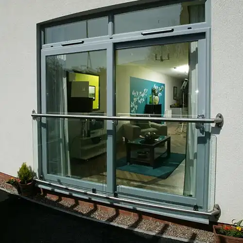 Sliding patio door in light grey PVCu material supplied for apartment block refurbishment