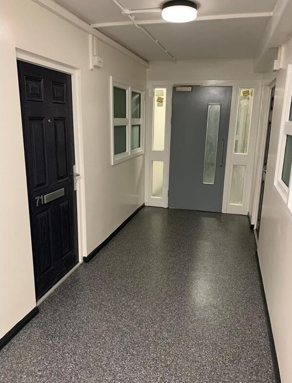 Fire door in hallway in block of flats.