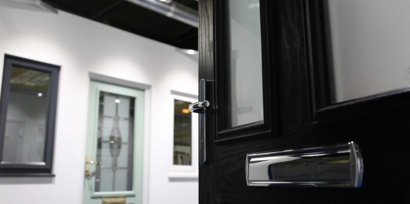 Black composite door in our product showroom