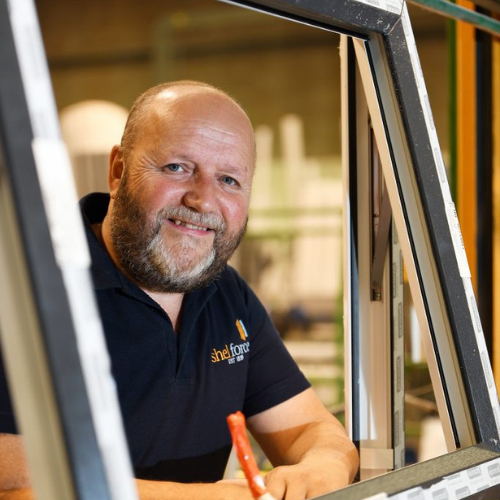 shelforce member posing inside a window frame