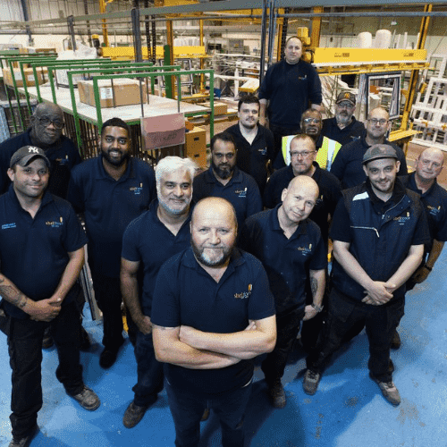 The shelforce team posing in the factory